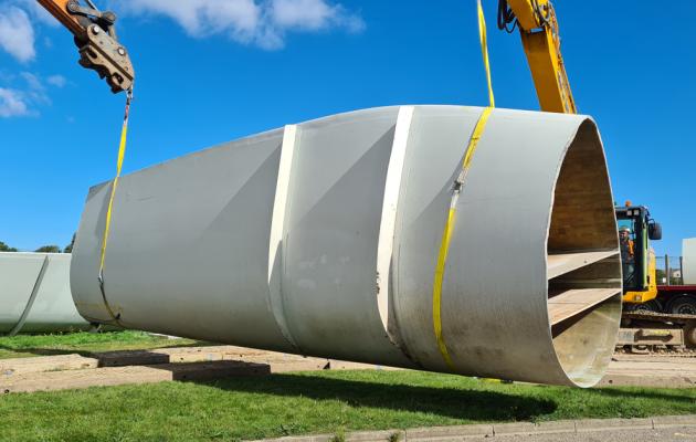 Cut blade being removed from site