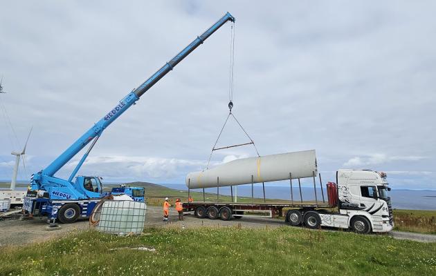 A segment of wind turbine blade being lifted