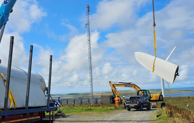 A wind turbine blade segment being loaded