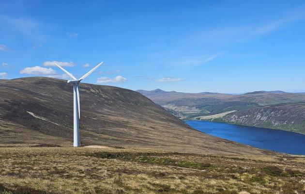 A wind turbine in a scenic landscape