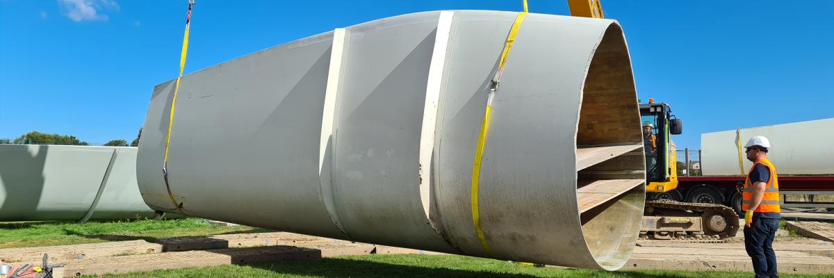 Decommissioned wind turbine blade segment being loaded