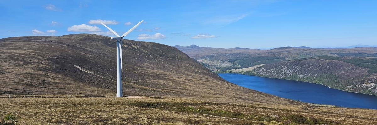 A wind turbine in a scenic landscape